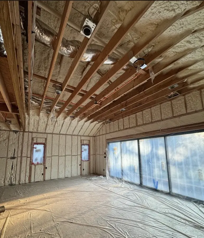 Interior walls and ceiling insulated with spray foam during new construction in Revere